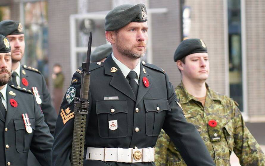 officers marching in formation, representing the path applicants take to join the RCMP in Alberta.