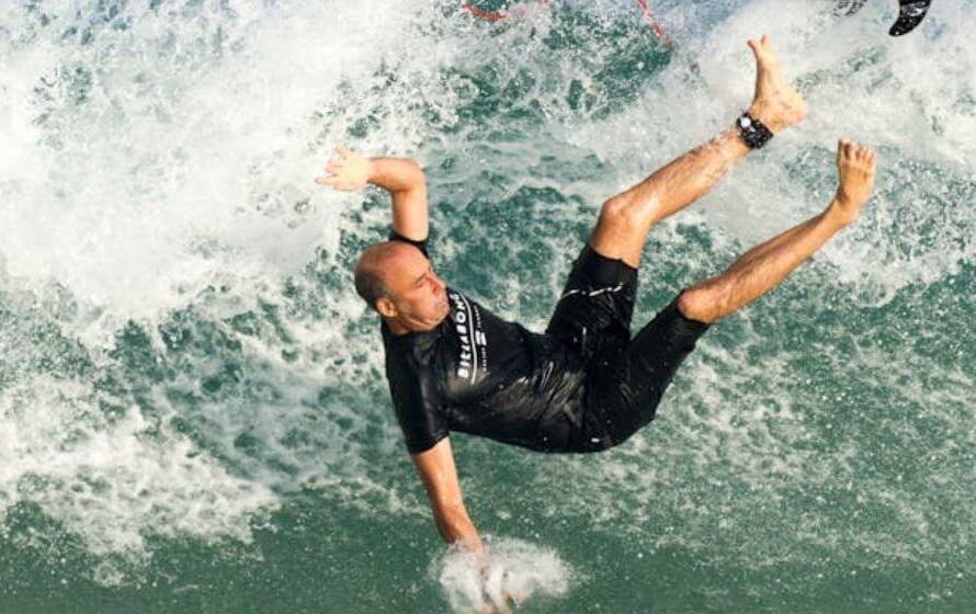 Athlete falling into water symbolizing failing the RCMP fitness test and retrying