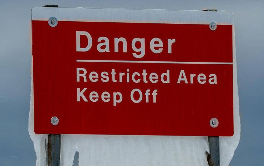 Danger sign representing risks associated with RCMP policing duties