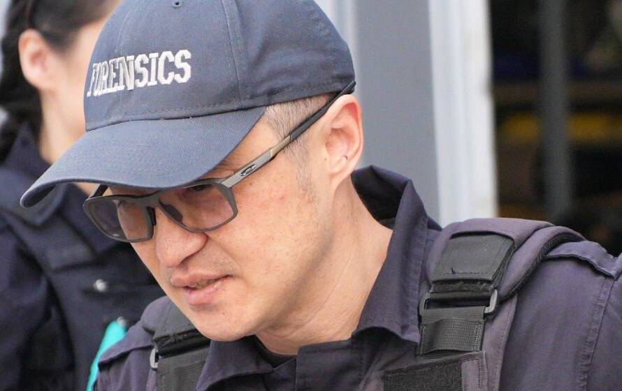 RCMP forensic officer in uniform speaking during an operational or training activity