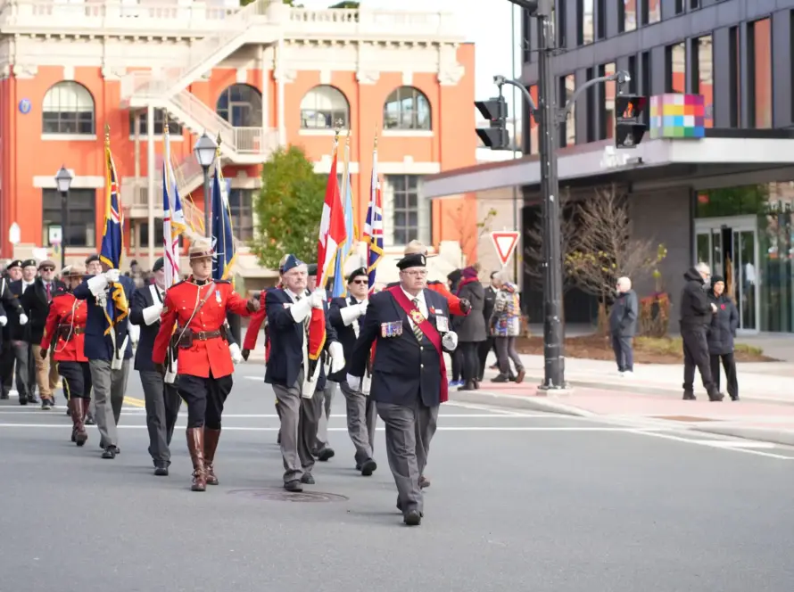 RCMP age limit recruiting Remembrance Day parade veterans Canadian flags 2025