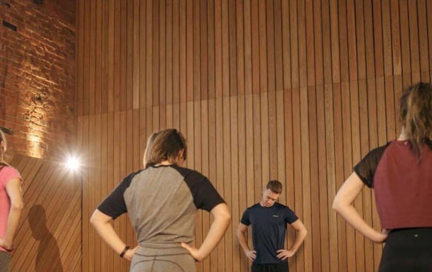 Group of trainees recovering between exercises during elite RCMP Level 4 fitness training session