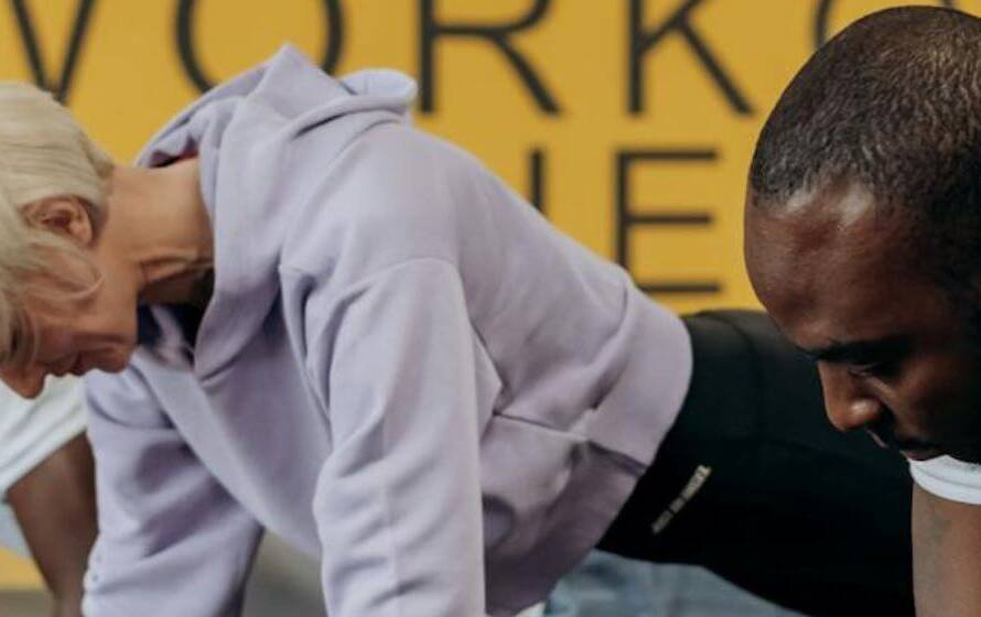 Group performing plank exercise during advanced RCMP Level 3 fitness training program